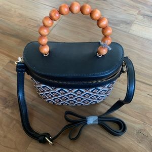 Black & clay geometric pattern.  Removable strap